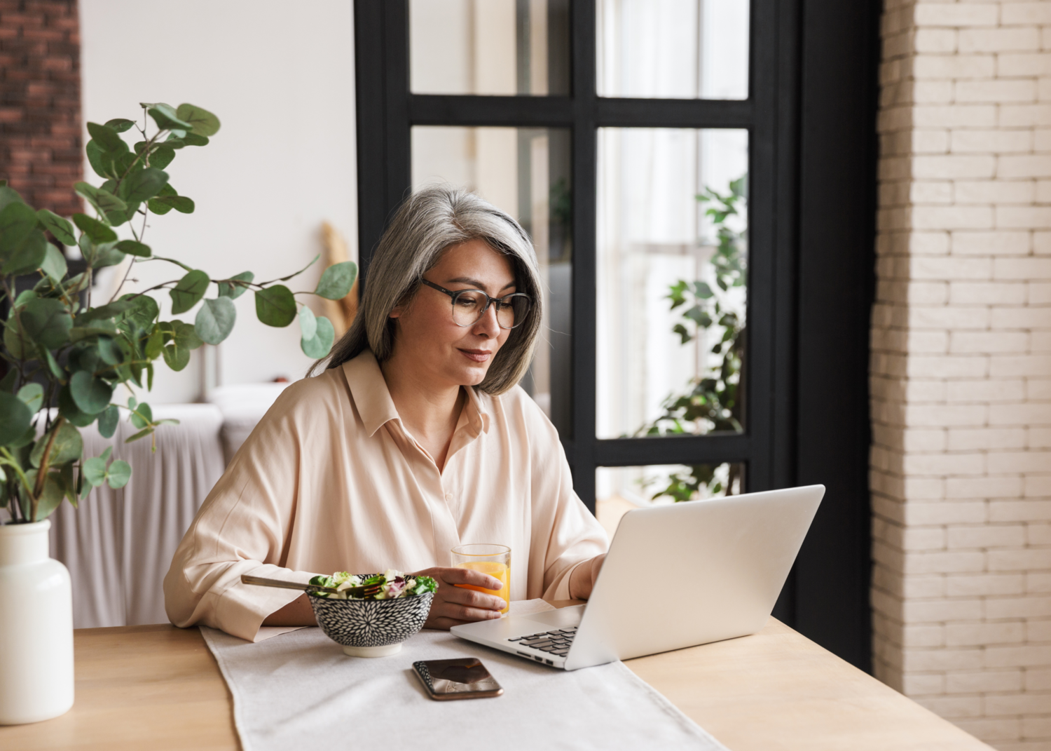 Lady Looking At Her Laptop