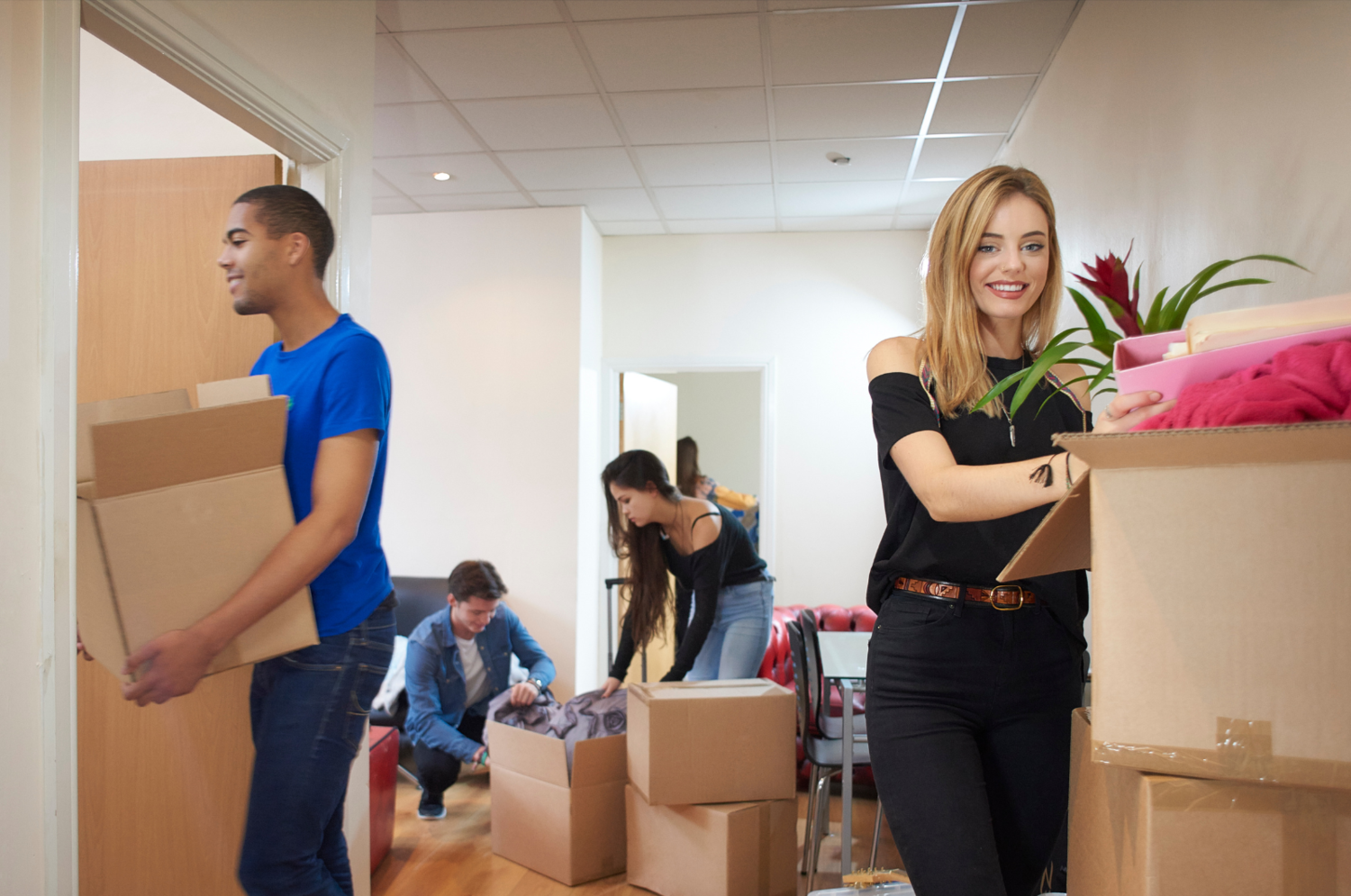 Bunch Of Young People With Boxes