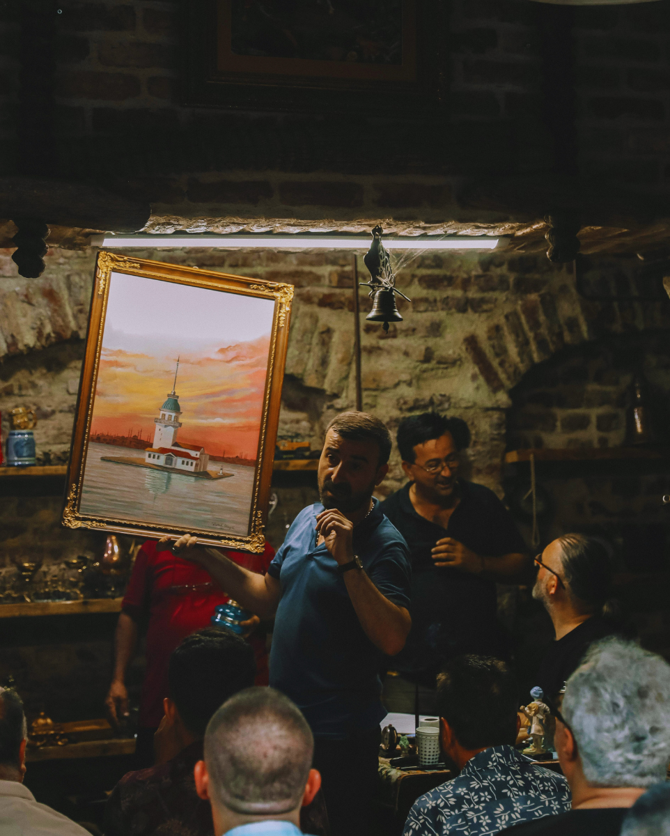 Man Holding A Painting
